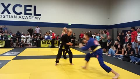 Girl fights boy gi jiu jitsu