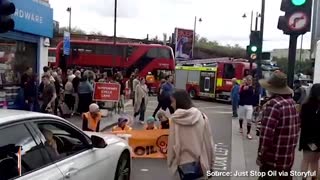 Angry Motorist PHYSICALLY DRAGS Climate Activists Off Street to Unblock Traffic