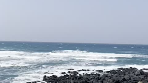 The scenery of the wavy sea in Jeju Island, Korea