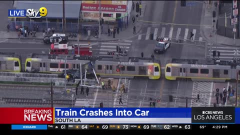 1 injured, car split in half after collision with train in South Los Angeles