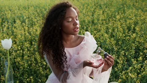 Push in Shot of a Young Woman Spraying Perfume