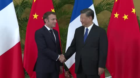 Macron, Xi shake hands as talks start in Bali | AFP