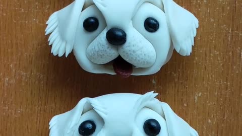 Making dogs sculpture on clay very cool