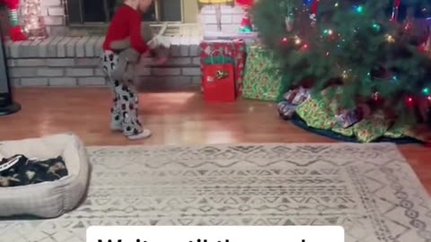 Sweet boy only cares about giving his mom her gift on Christmas.