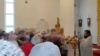 Orthodox Priest Sprays Congregation With Holy Water Hose