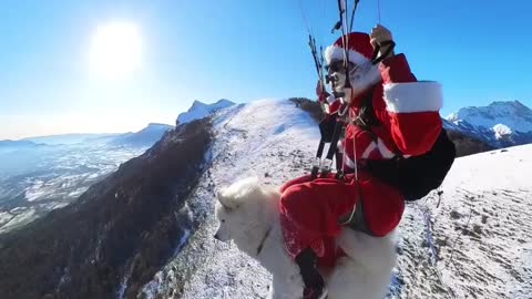 Paragliding Santa Claus Rides on Dog