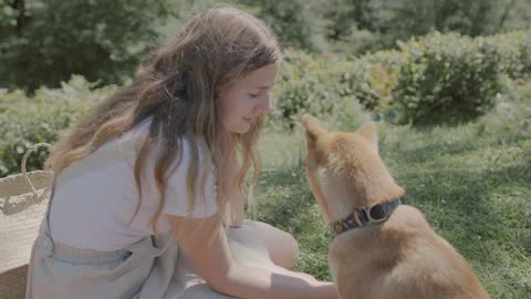 A Woman Petting Her Dog