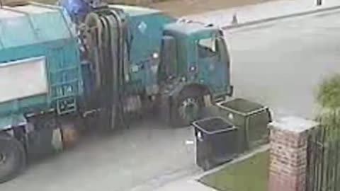 The garbage truck takes out the garbage