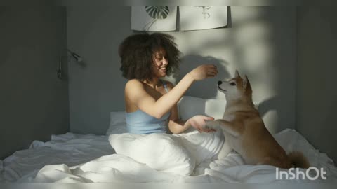 A sweet women playing with her pet dog