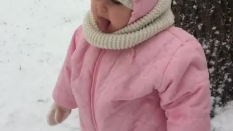 Toddler super excited to be out in snowstorm