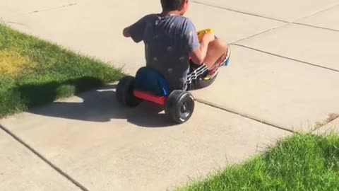 Adorable little child is playing with trolley and enjoying children's time