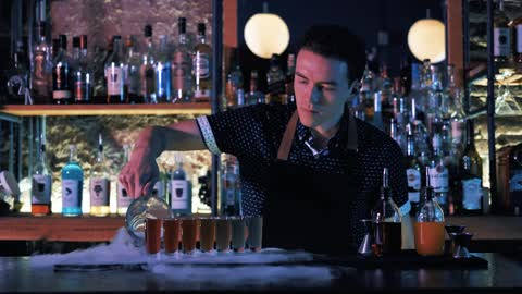 Bartender preparing shots