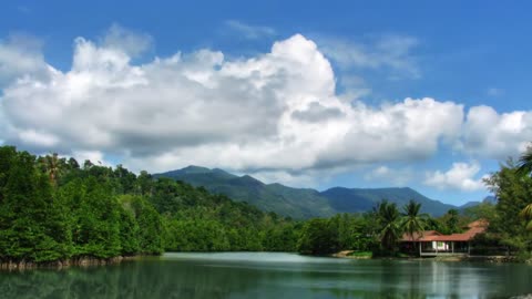 Beautiful lakes and trees under blue sky and white clouds