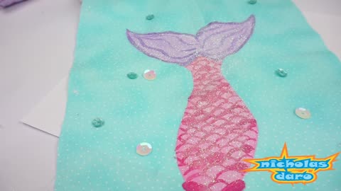 Painting a Mermaid and Shell Swimming in the Ocean