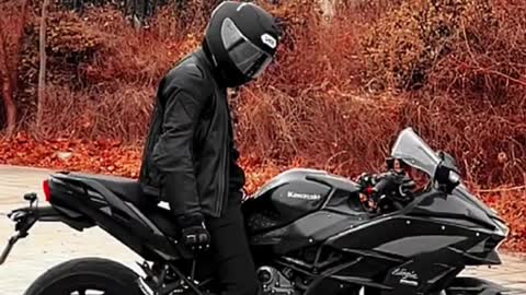 Cool Biker with his Black Ride