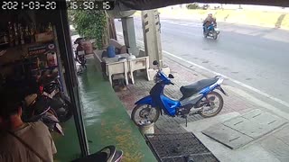 Truck Rolls Under Awning in Thailand