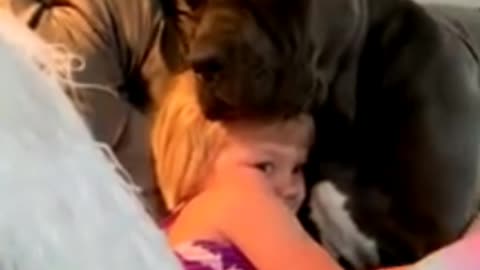 Baby hugs her dog and wanna sleep