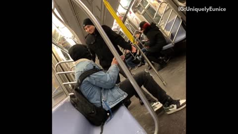 Two men fighting on train guy in beanie standing