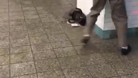 Old man dances in subway station