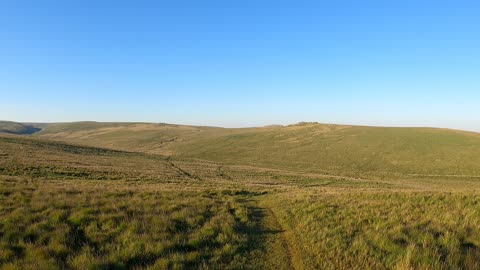 Drone footage. Panning away from Beardown Tor.