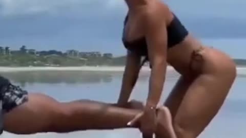 Partner Workout At Beach