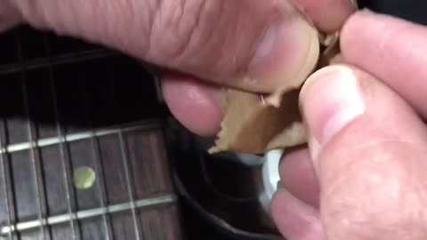 How to make a tiny polishing block with a brown paper bag, a guitar pick, and some tape...