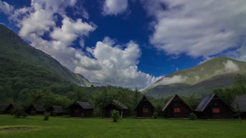 Wooden Cabins For Travelers Built On The Mountains Valley