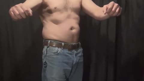 Fat man flexes his flab 3 of 14