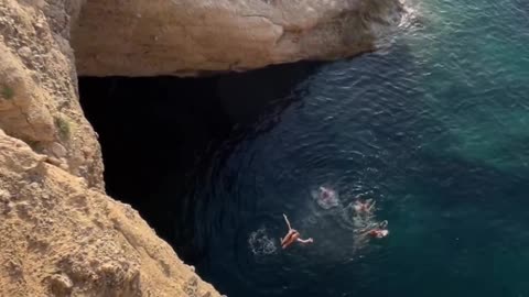 🌊 "Epic Cliff Dive: Defying Gravity with Adrenaline!"