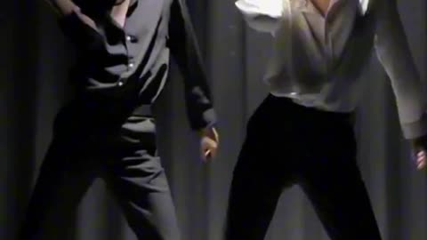 Two handsome guys dancing