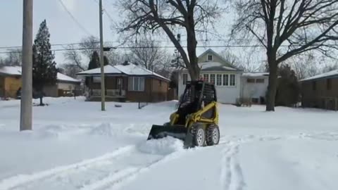 CLEAN SNOW WITH MINI SKID LOADER