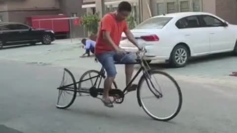 Car repairers rebuild bicycle tires.