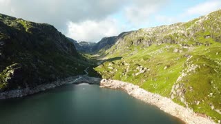 Different Aerial Views Of Mountains And Body Of Water