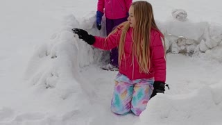 Girls igloo building