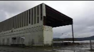 Tugboat pulling down building