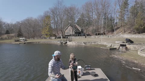 Boy Catches Big Bass With Dad