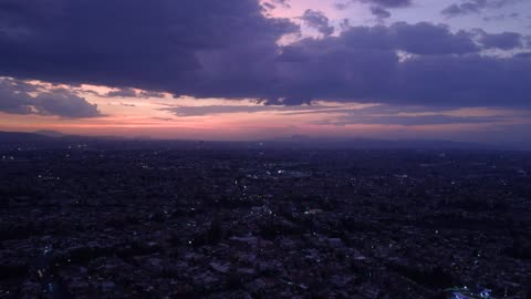 Aerial landscape of a huge city at dusk...