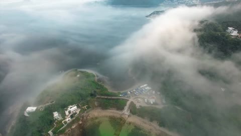 Beautiful View of a Forest, Lake, Mountains, Clouds and a rich village