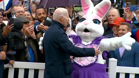 Secret Service in disguise as the Easter Bunny Is Forced to Usher Biden Away from Children