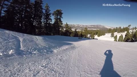 Guy red black snow jacket snowboard jump fail