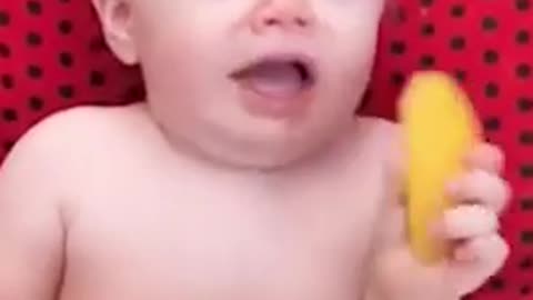 Baby eating first time lemon reaction...