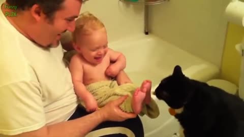 Father and baby fun with cat