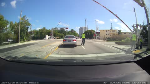 Car Nearly Clipped by Passing Train