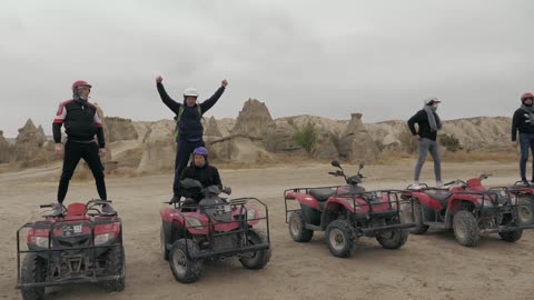 People Enjoying on ATV at Desert