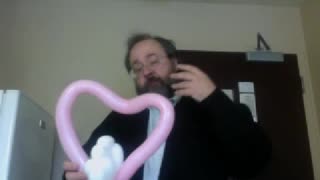 Balloon twisting - love birds on a heart-shaped swing