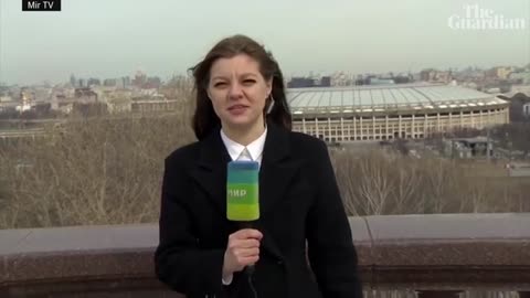 Dog interrupts live weather report in Moscow borrowing journalist's microphone