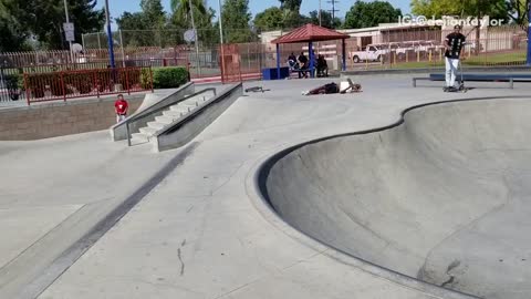 Boy white shirt blonde hair flip scooter face plant