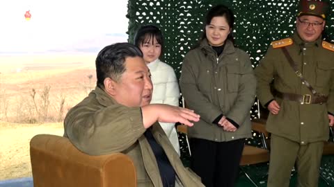 Photos of Kim overseeing North Korean ICBM launch with daughter in tow.