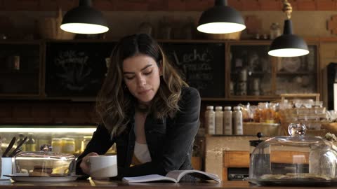 Woman drinking coffee in a cafe