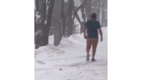 Guy Walks Through Blizzard In Shorts!